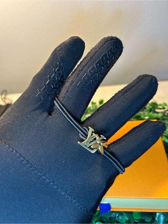 Louis Vuitton Jewelry - Louis Vuitton Black Leather Cord Bracelet with Gold LV Flower Charm